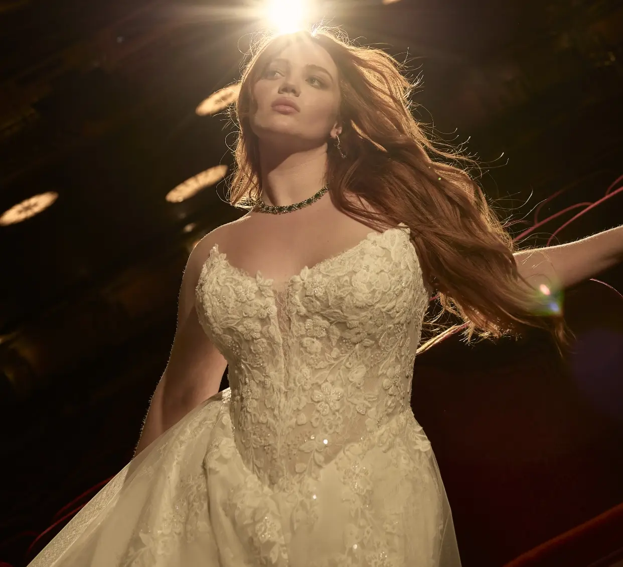 Model With A Spotlight Behind Her Wearing Lace A-line Wedding Dress Called Hadley By Maggie Sottero
