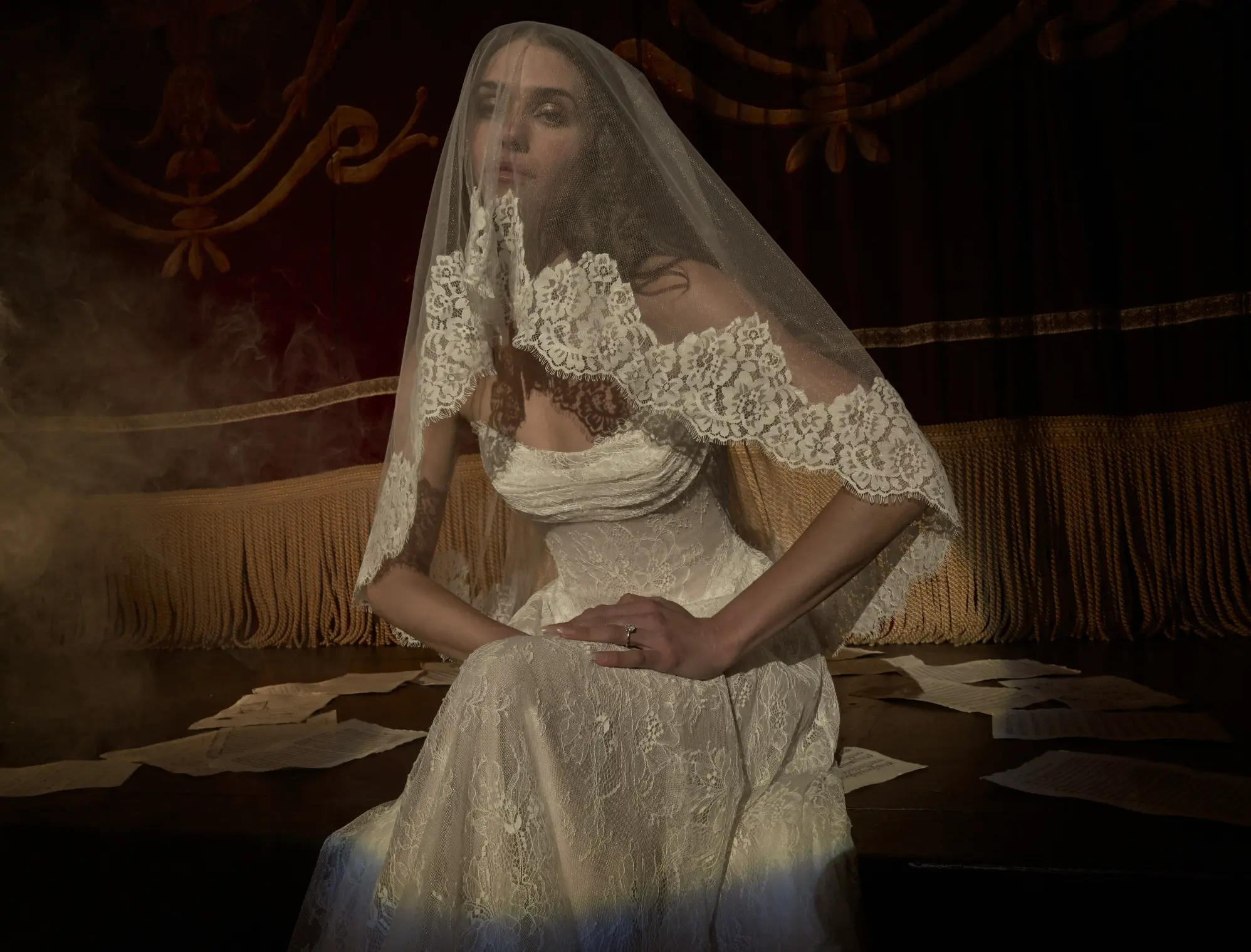 Model In A Dark Room Wearing Lace Wedding Dress Called Maelle By Maggie Sottero