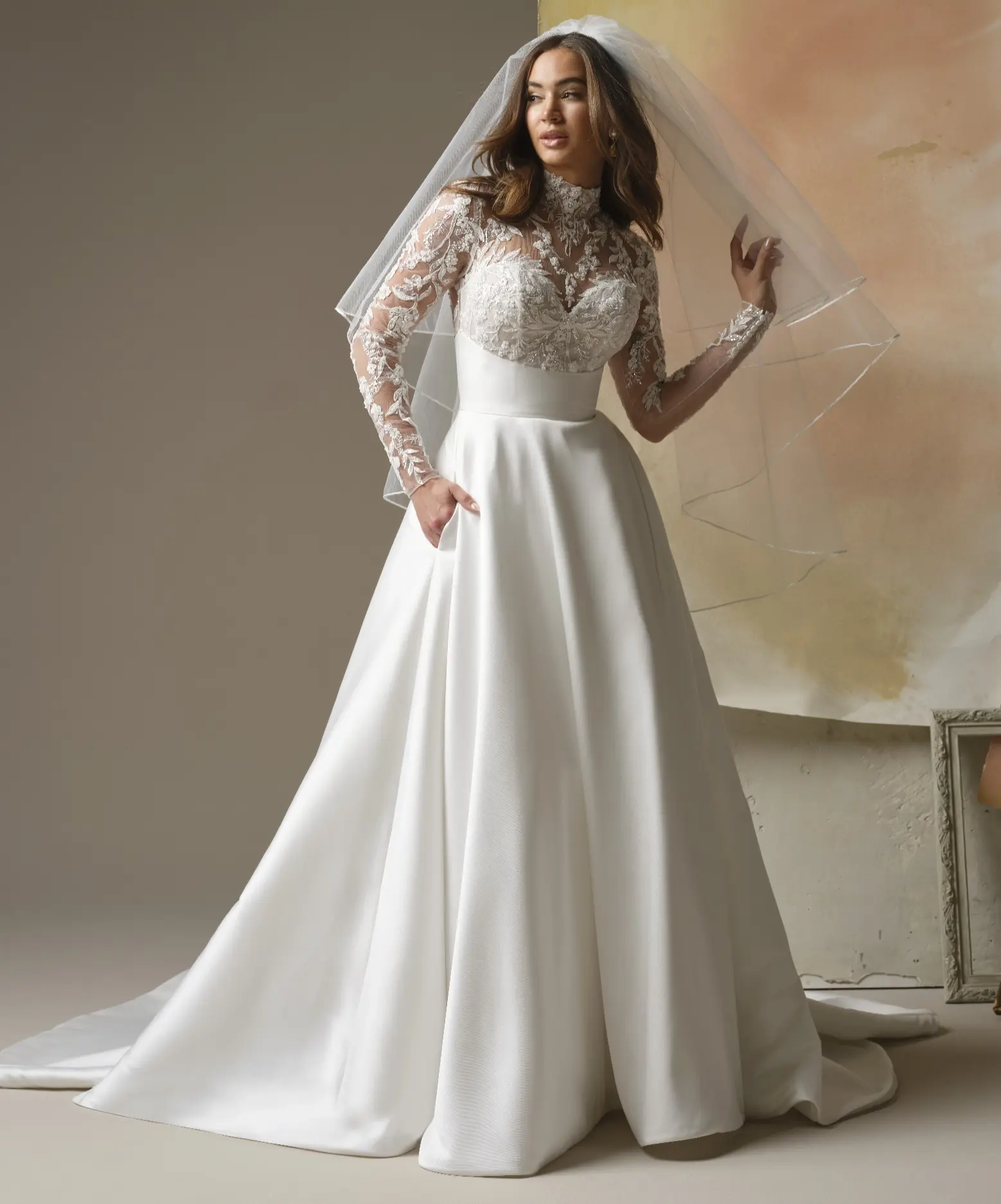 Model In A Studio Wearing Crepe A Line Wedding Dress Called Trinity By Maggie Sottero