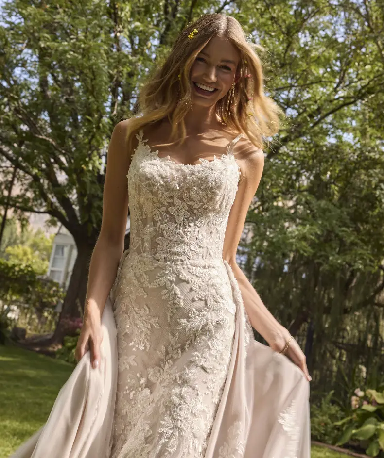 Model Walking Outside Wearing Lace Wedding Dress Called Eden By Rebecca Ingram