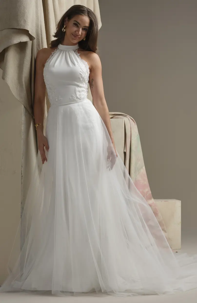 Model In A Studio Wearing Plain Tulle Overskirt By Maggie Sottero