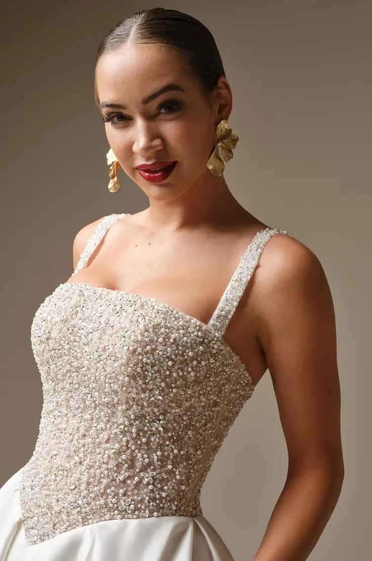 Model In A Studio Wearing Pearl Beaded Wedding Dress Called Dmara By Sottero And Midgley