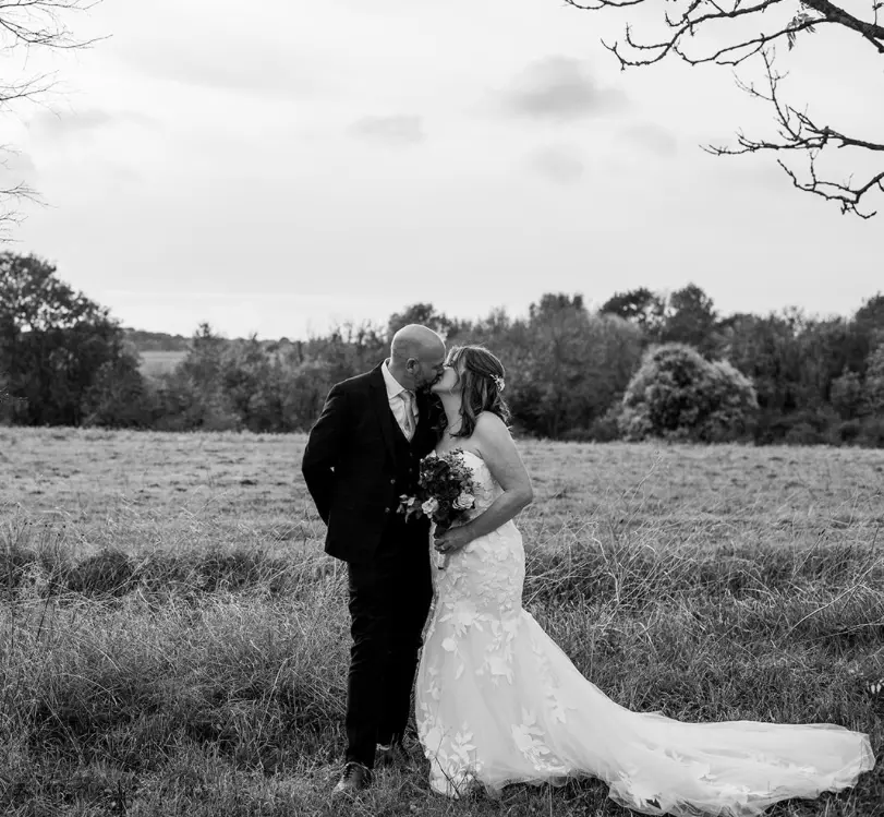 Bride In Lace Mermaid Wedding Dress Called Hattie By Rebecca Ingram With Groom
