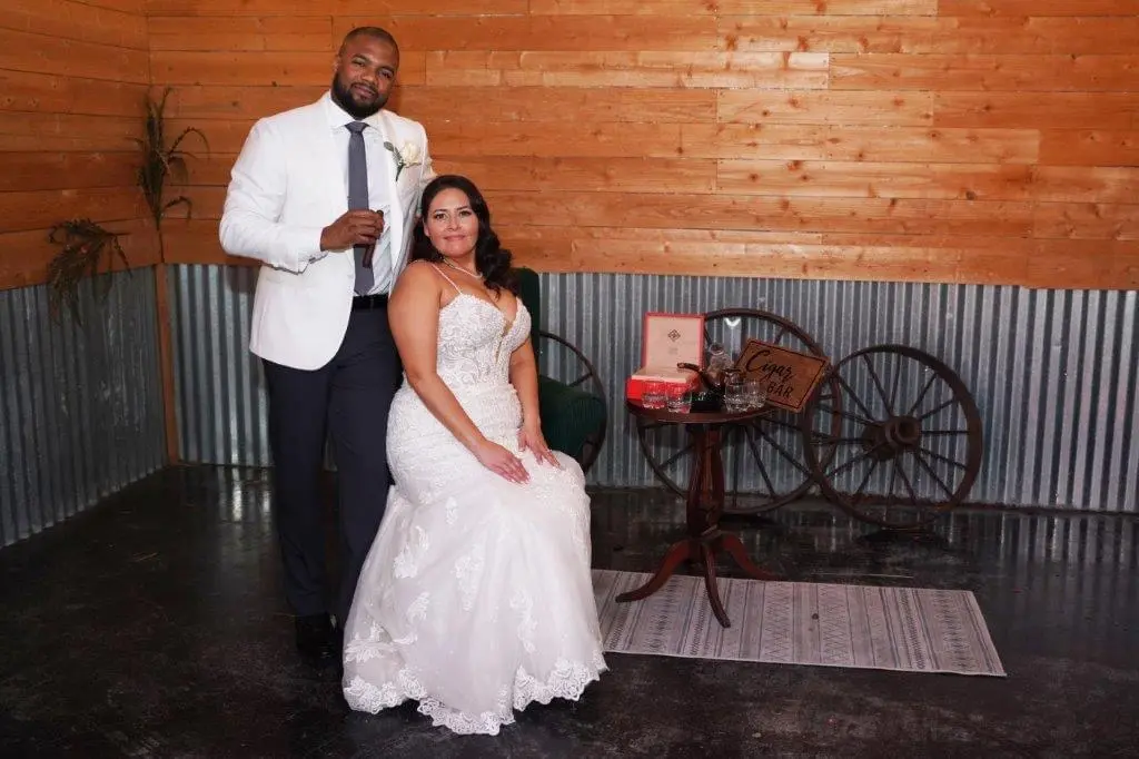 Bride wearing Fiona by Maggie Sottero with her husband