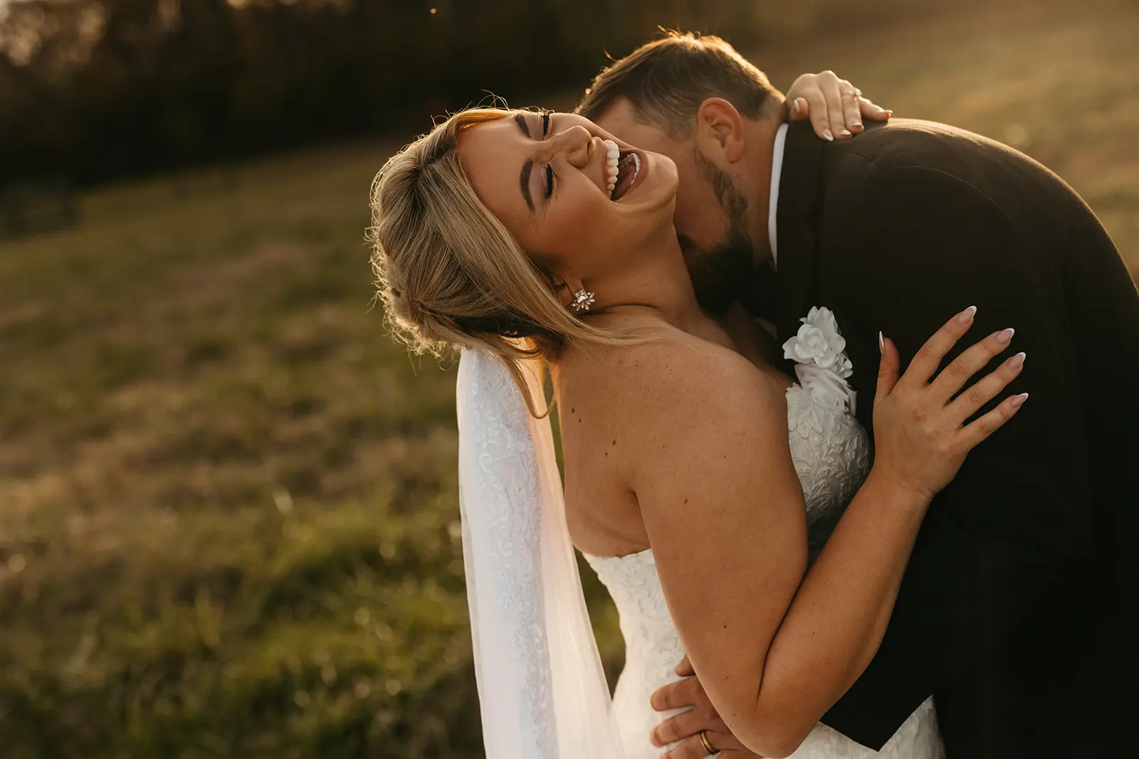 Bride Wearing Lace Mermaid Wedding Gown Called Toccara By Maggie Sottero With Groom Kissing Her Neck