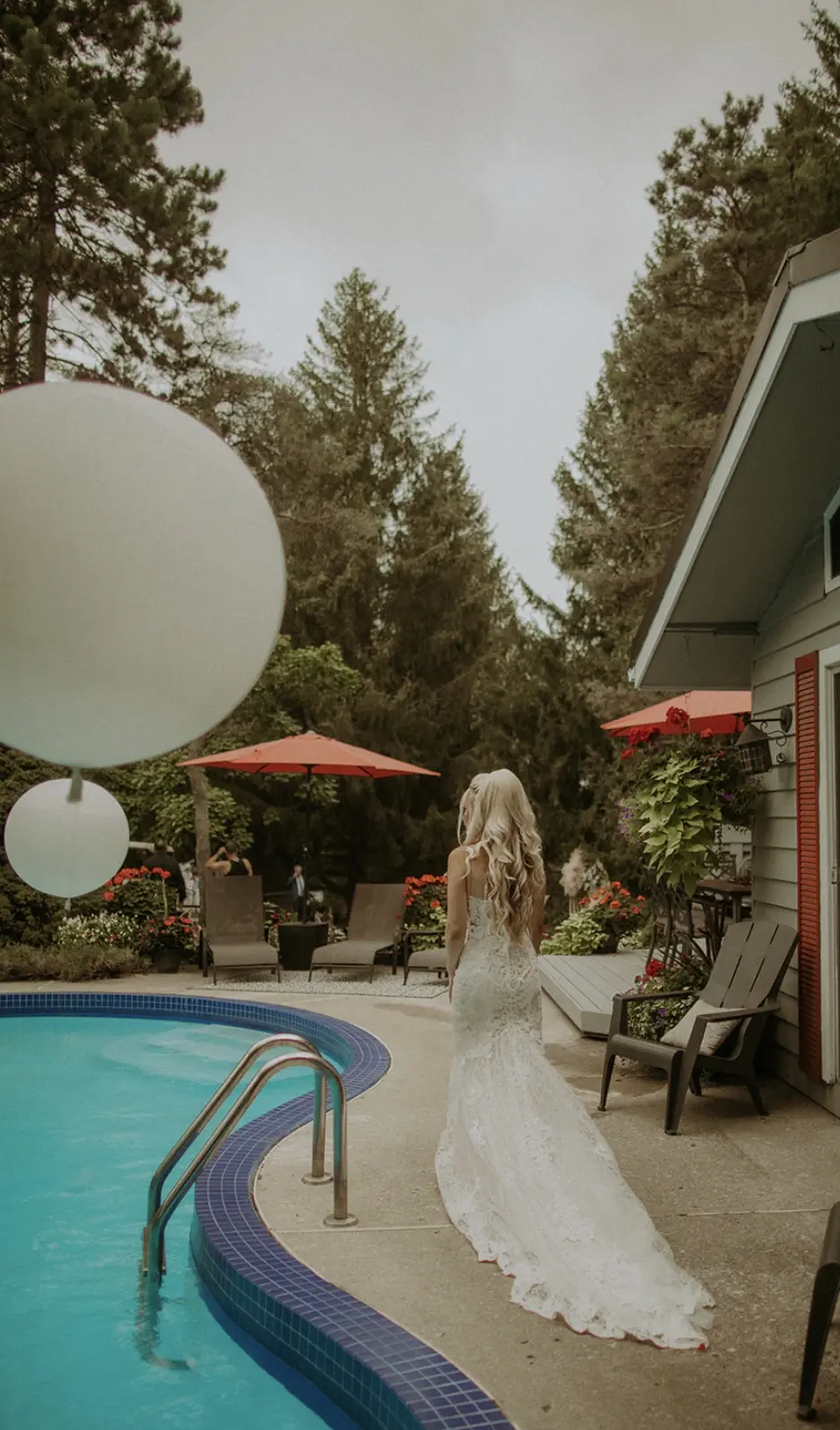 Bride wearing Lace Fit-and-Flare Wedding Dress called Tuscany Lynette by Maggie Sottero by a pool